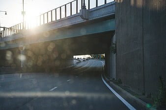 Sunlit Highway Underpass with Bokeh Effect