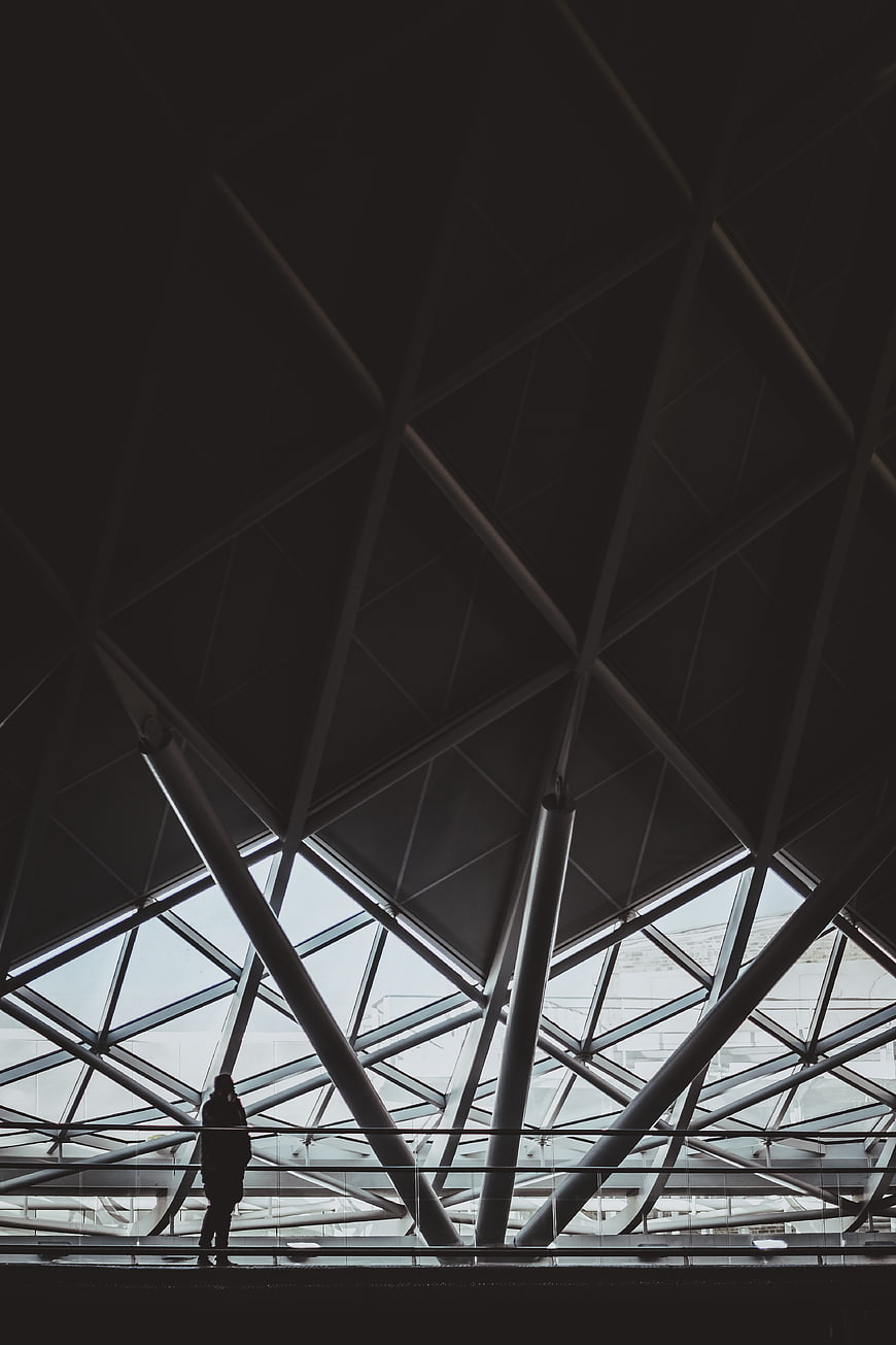 Silhouette of person in modern geometric architecture interior