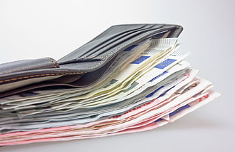 Open Leather Wallet Overflowing with Euro Banknotes