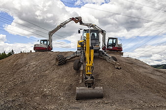 Low angle view of excavators on a construction site
