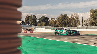 Green Mercedes-AMG GT3 Race Car on Circuit Track