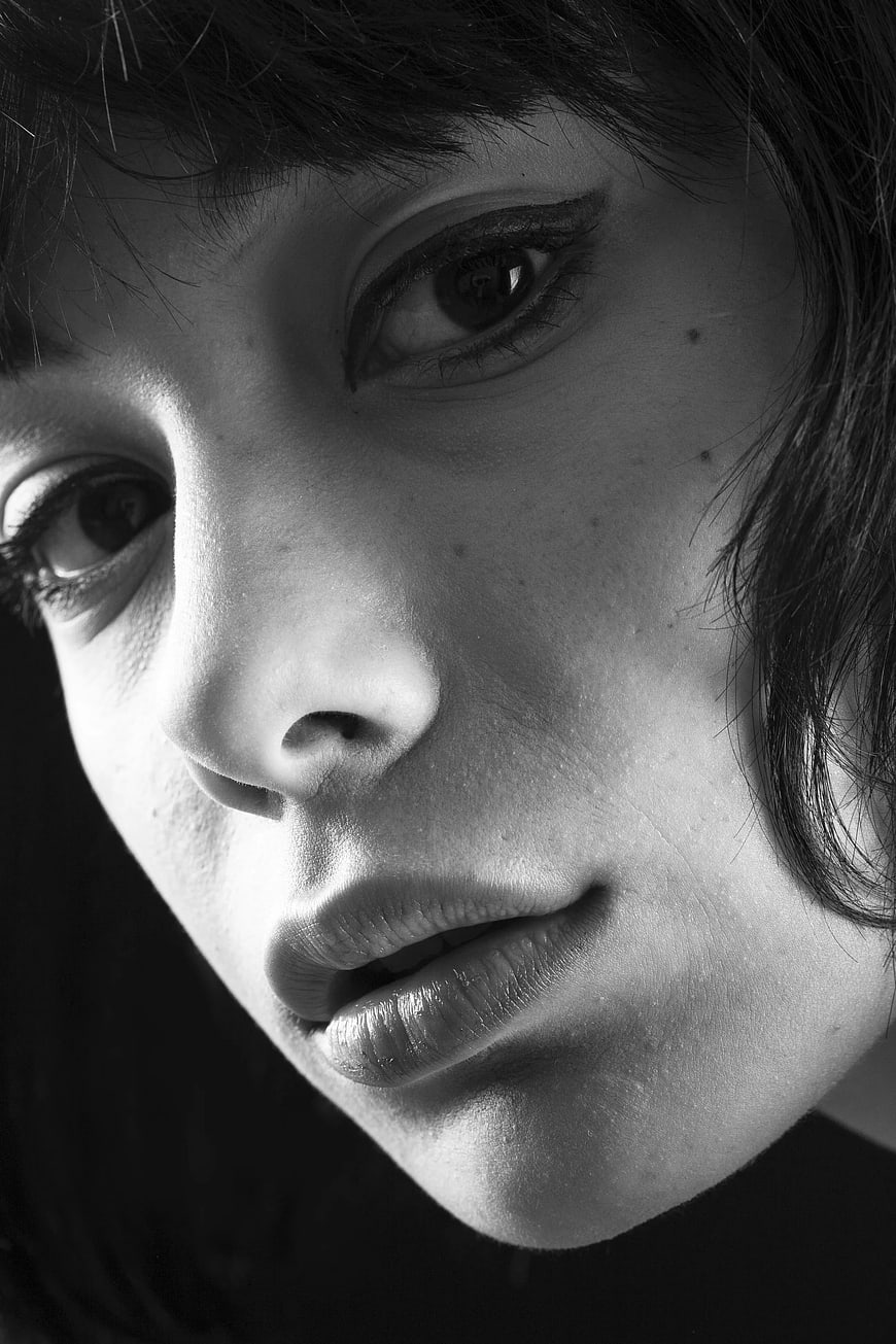 Close-up black and white portrait of woman's face