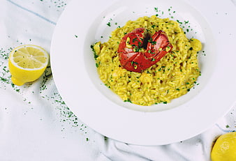 Lobster Risotto with Lemon on White Plate