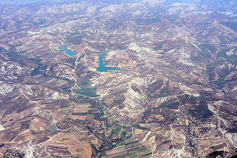 Aerial View of Mountainous Landscape with Lakes and Fields
