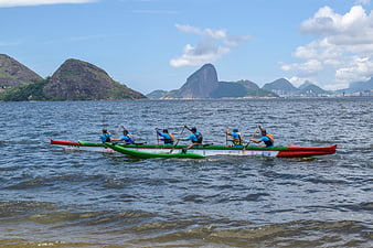 Traditional Canoe Racing Team Paddling On Rio De Janeiro Bay