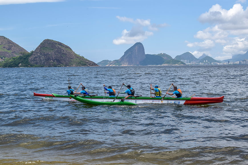 Traditional Canoe Racing Team Paddling On Rio De Janeiro Bay
