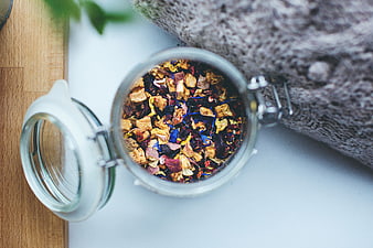 Top View of Dried Herbal Tea Mix in Glass Jar
