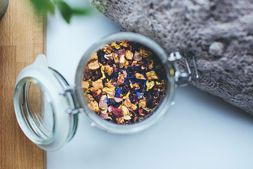 Top View of Dried Herbal Tea Mix in Glass Jar