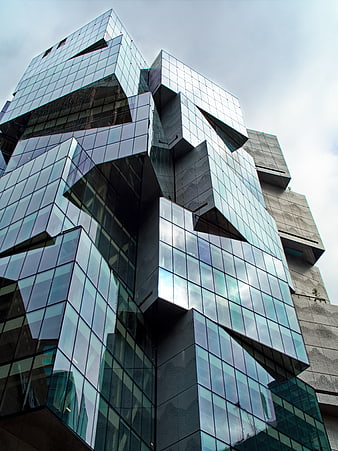 Low angle view of modern glass cube architecture