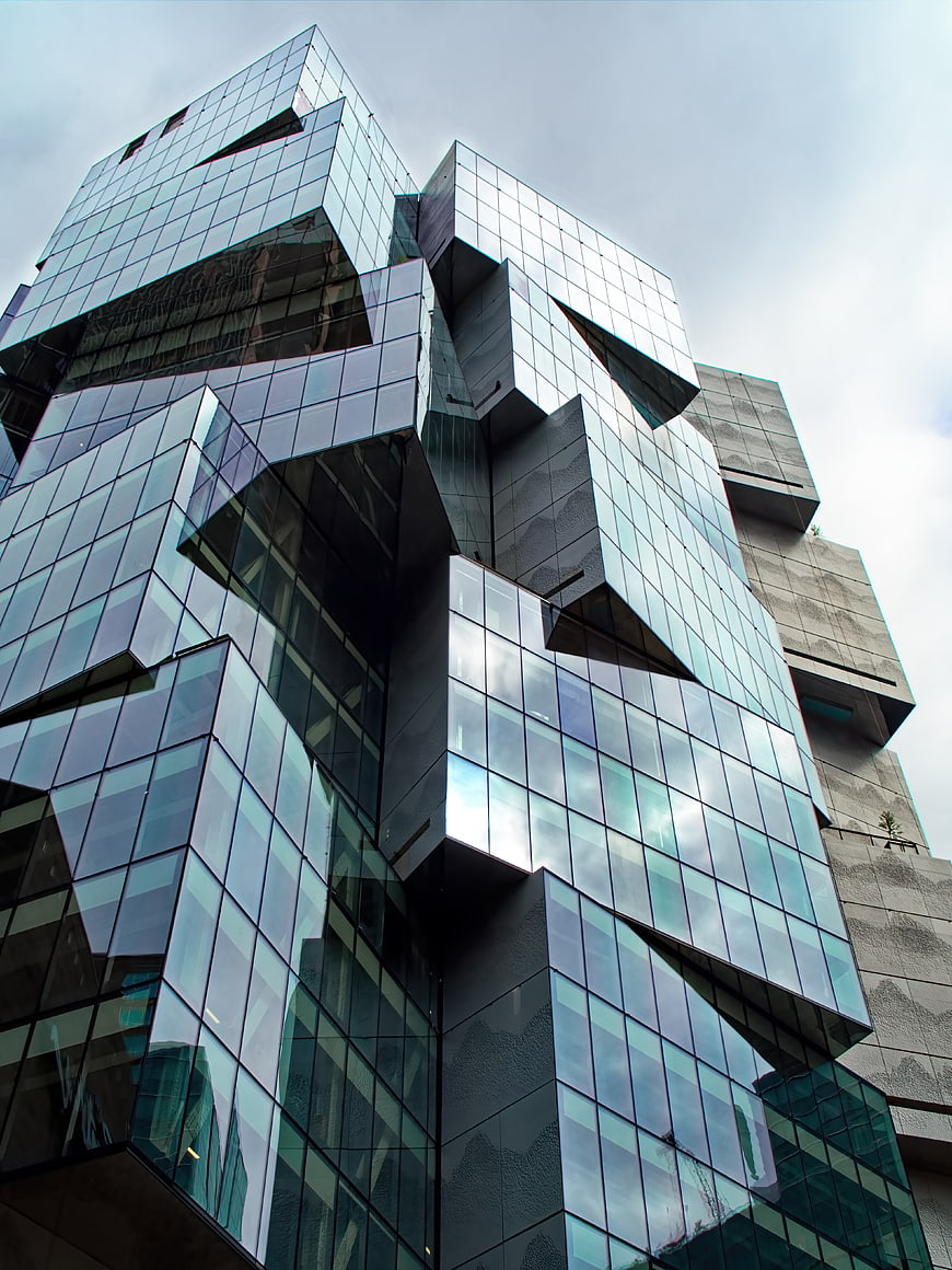 Low angle view of modern glass cube architecture