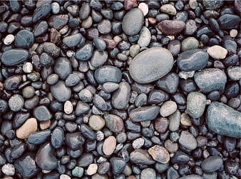Wet Smooth River Stones and Pebbles Texture Background