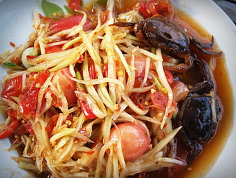 Thai Som Tum Salad With Crab And Sausage On White Plate