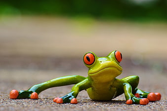 Cute Green Ceramic Frog Figurine with Orange Eyes