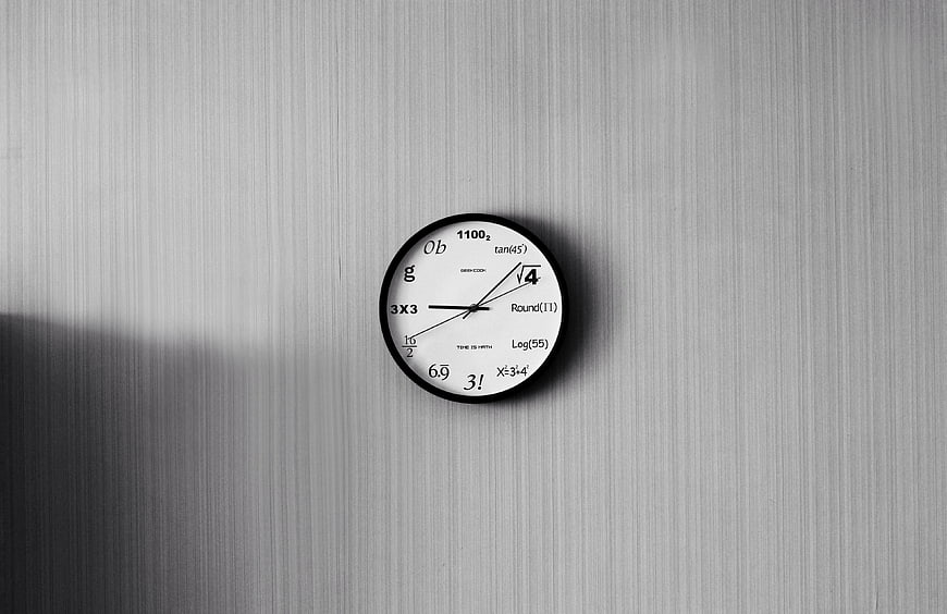 Minimalist Math Clock on Textured Wall