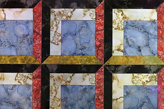Colorful geometric marble tile pattern with blue and red stone