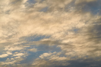 Dramatic golden hour cloudscape with textured sky