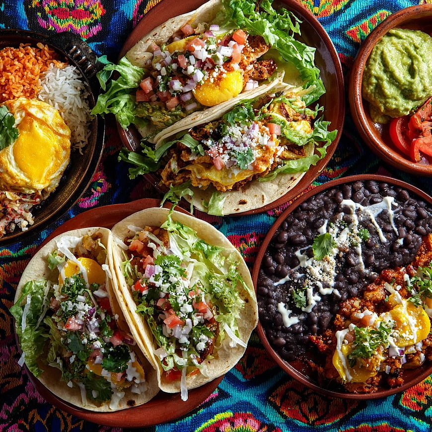 Overhead View of Colorful Mexican Tacos with Beans and Eggs