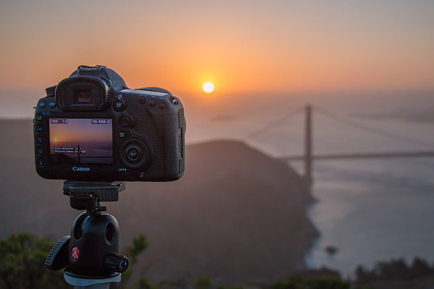 DSLR Camera on Tripod Filming Golden Gate Bridge Sunset