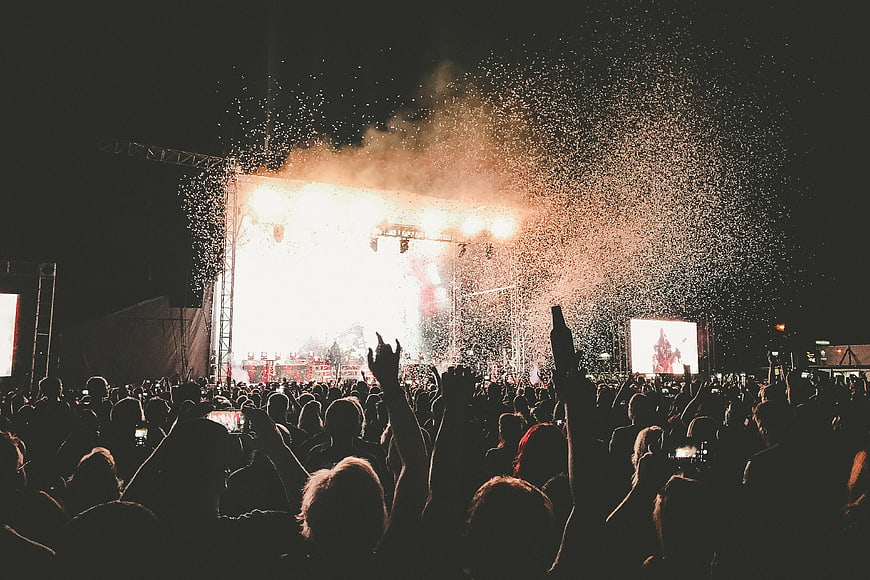 Music Festival Crowd With Confetti And Stage Lights
