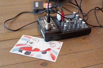 Audio Mixer and Skateboarding Mouse Illustration on Wood