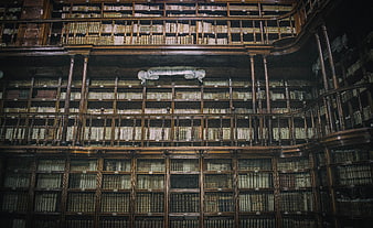 Historic Library Interior With Antique Books And Wooden Shelves