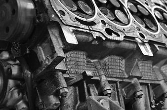 Close-up of vintage car engine block in black and white