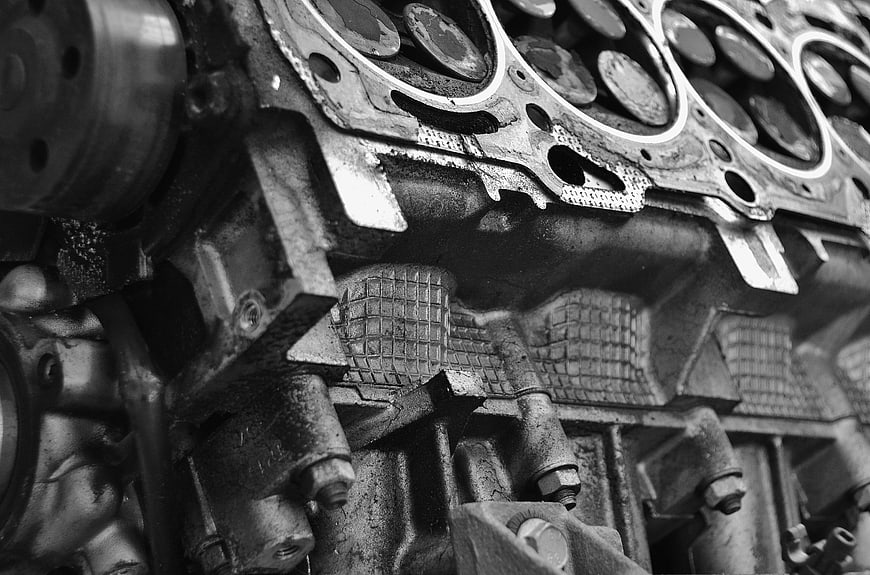 Close-up of vintage car engine block in black and white