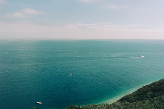 Aerial View of Turquoise Ocean with Boats and Coastline
