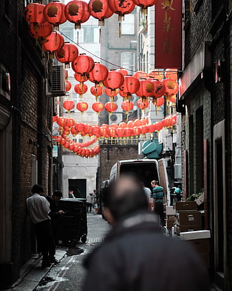 Narrow alleyway decorated with red Chinese lanterns