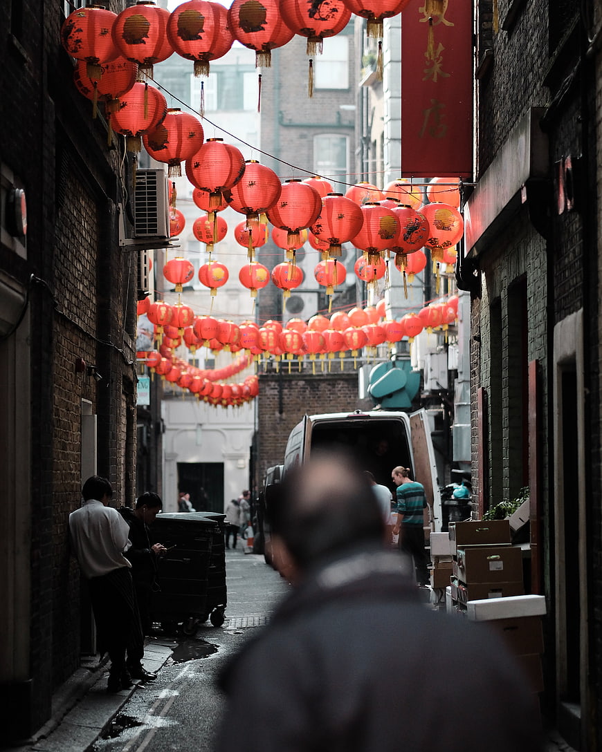 Narrow alleyway decorated with red Chinese lanterns