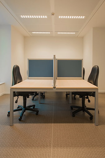Modern office workspace with desks and chairs