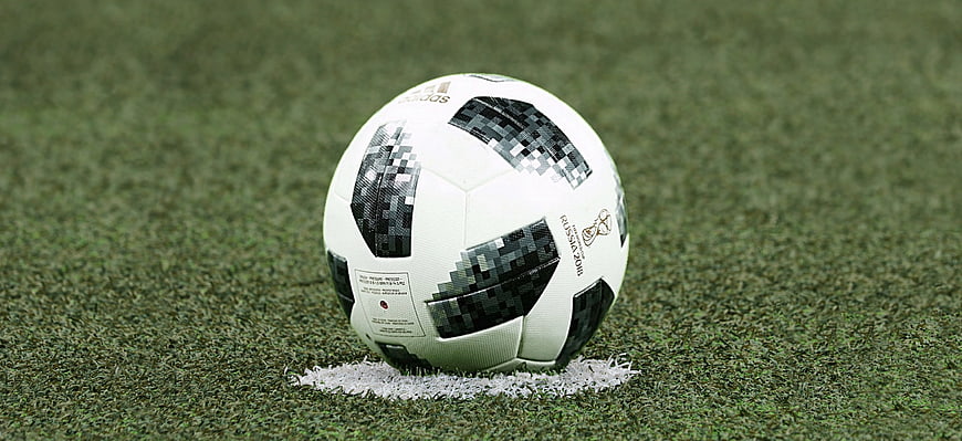 Soccer ball on artificial turf pitch