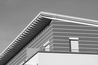 Modern architectural detail of gray and white building facade