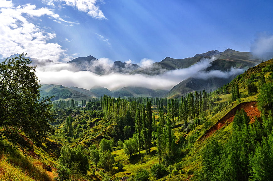 Misty Mountain Valley Landscape With Green Hills And Clouds