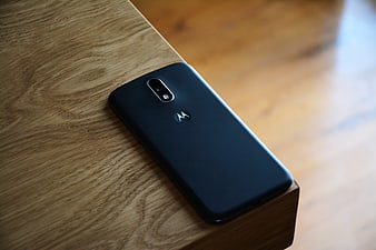 Black Motorola Smartphone on Wooden Table Surface