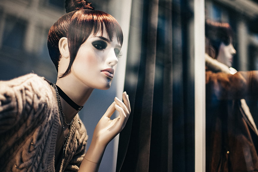 Fashion Mannequin in Window Display with Reflection
