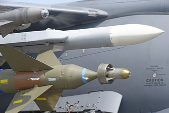 Close-up of military fighter jet missiles and aircraft fuselage
