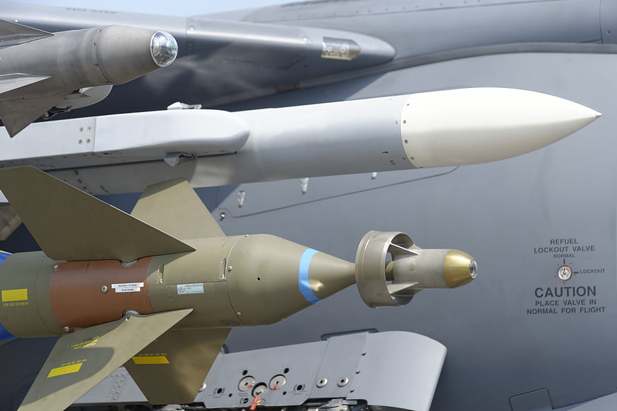 Close-up of military fighter jet missiles and aircraft fuselage