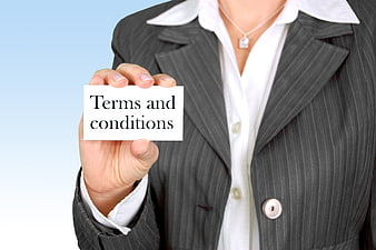 Businesswoman holding terms and conditions card