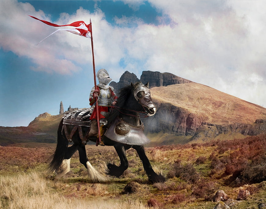 Medieval Knight on Armored Horse in Mountainous Landscape