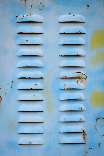 Rusty blue metal vent texture with weathered paint