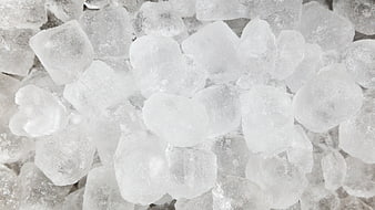 Close-up texture of white ice cubes filling the frame