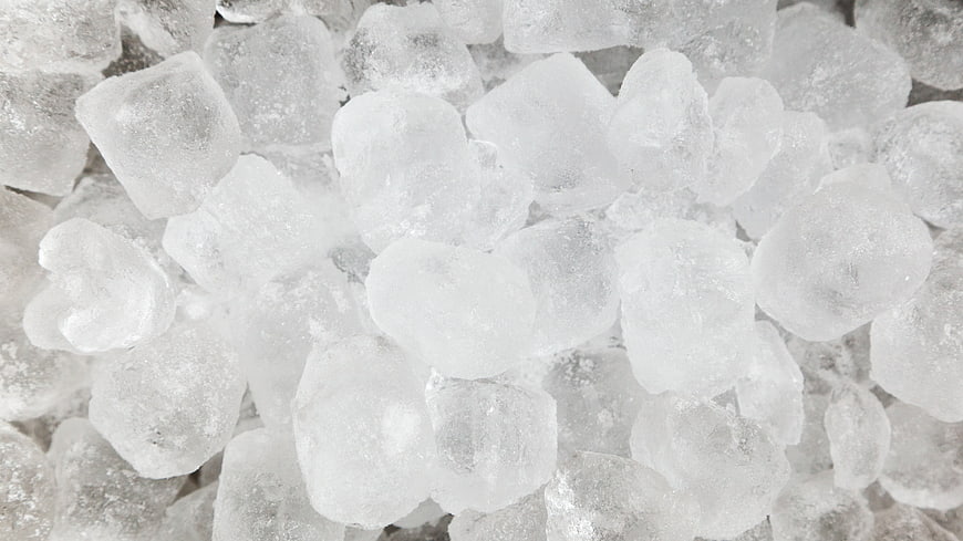 Close-up texture of white ice cubes filling the frame