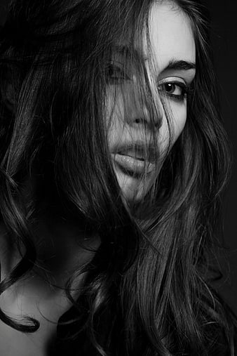 Dramatic Black and White Portrait of a Woman with Messy Hair