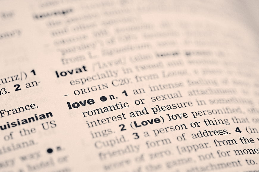Close-up of dictionary definition of the word love