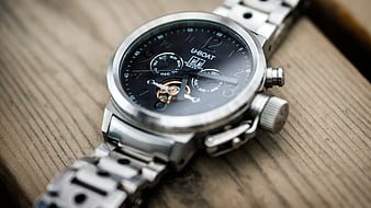 Silver U-Boat Chronograph Watch on Wooden Surface