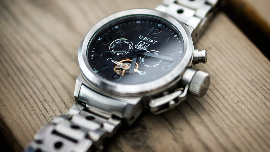 Silver U-Boat Chronograph Watch on Wooden Surface