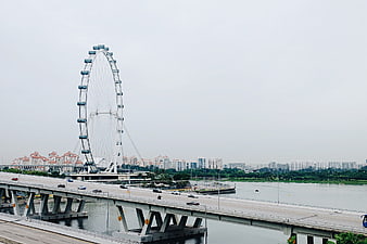 Singapore Flyer Ferris Wheel and Bridge Over River