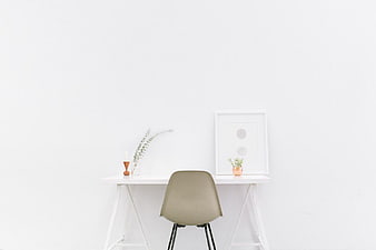Minimalist White Desk with Beige Chair and Decor