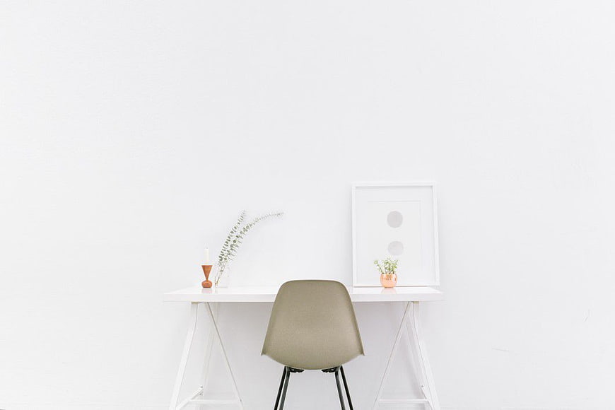 Minimalist White Desk with Beige Chair and Decor
